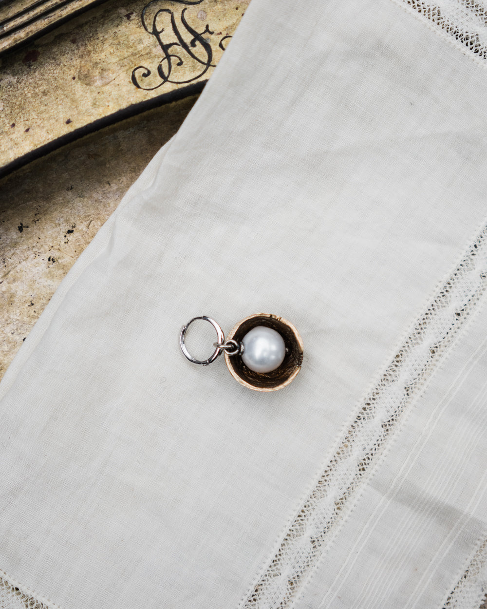 Nut Charm with a Natural Pearl