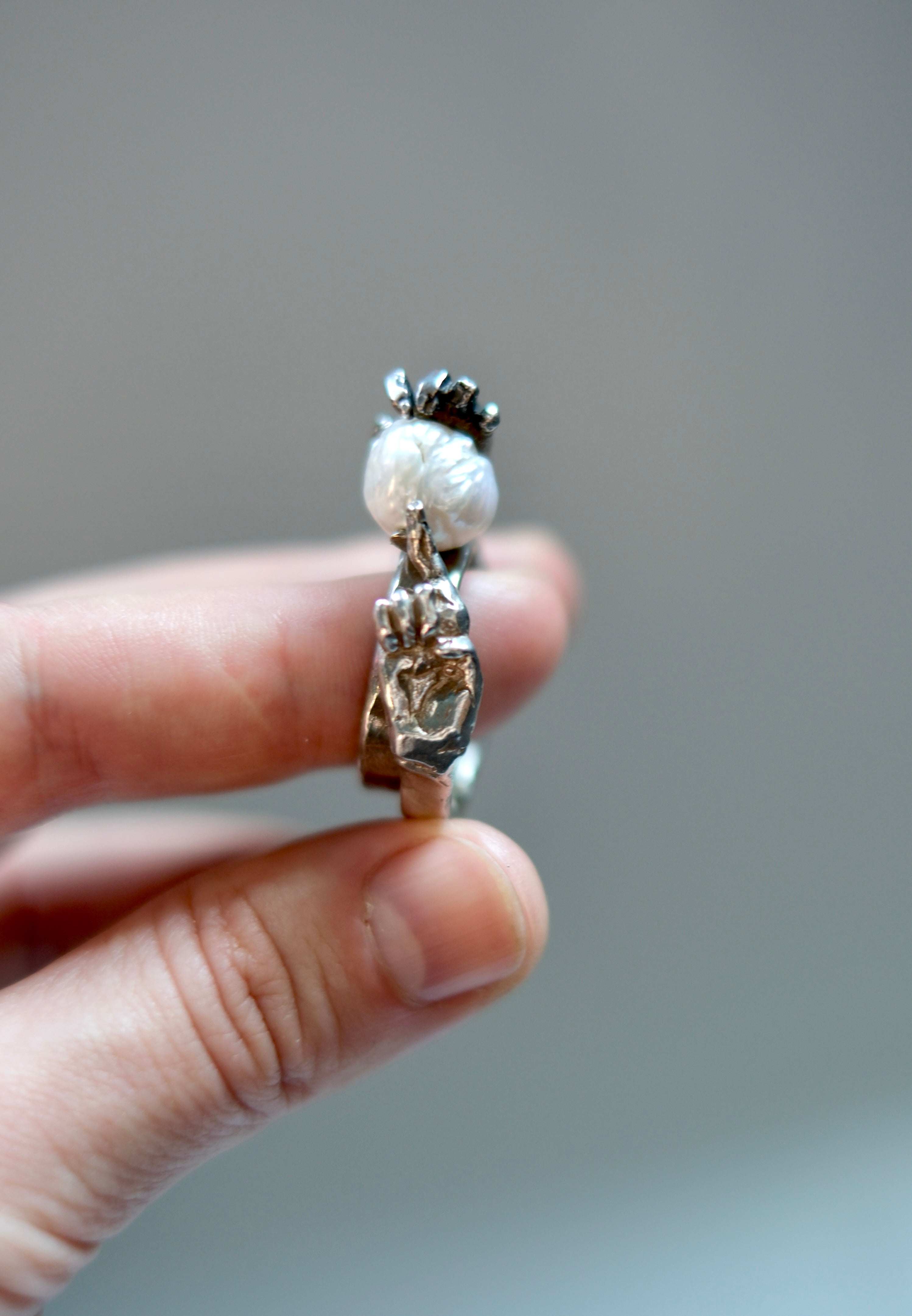 Hands Ring in Sterling Silver (with a Natural Pearl)
