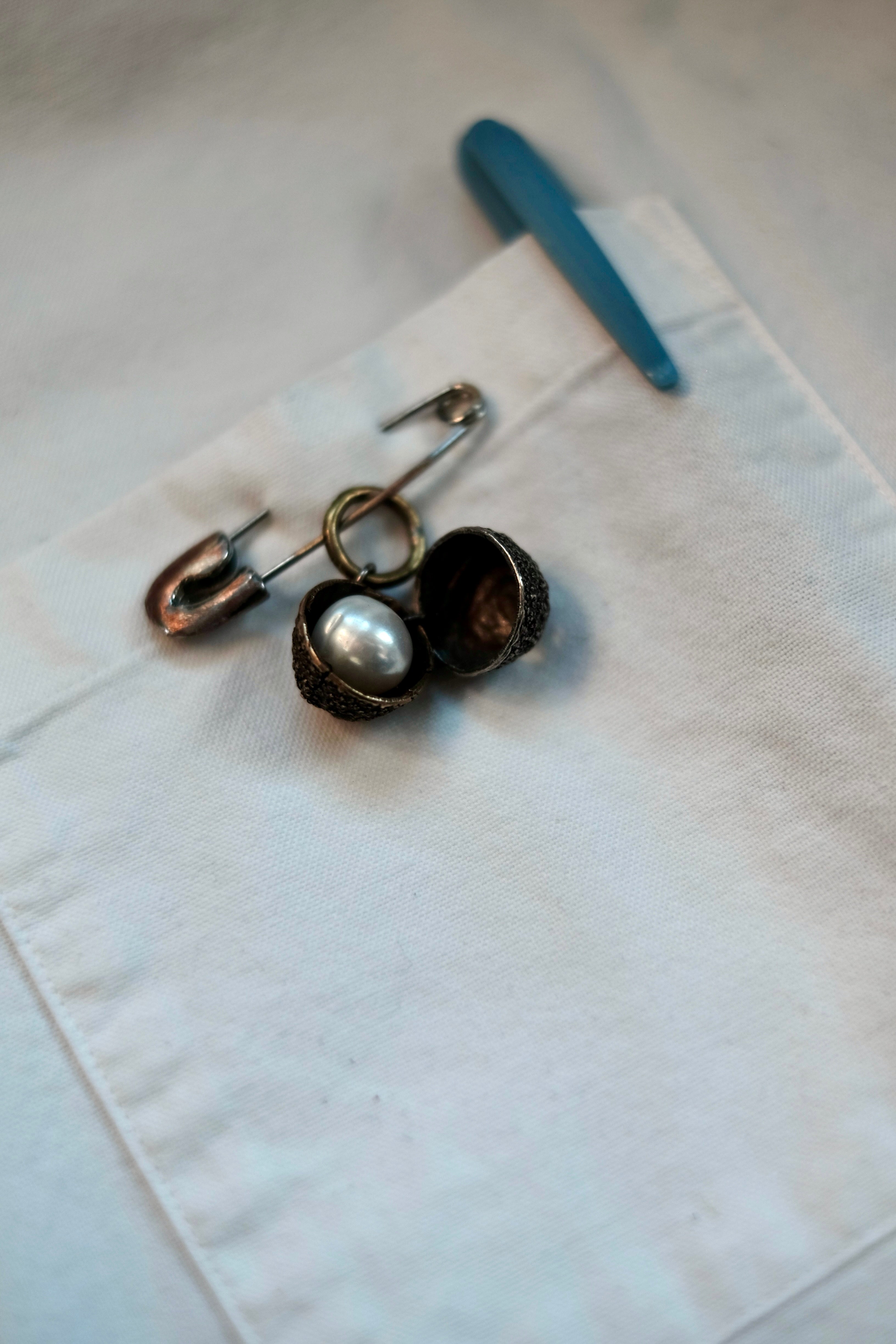 Nut Charm with Hidden Pearl