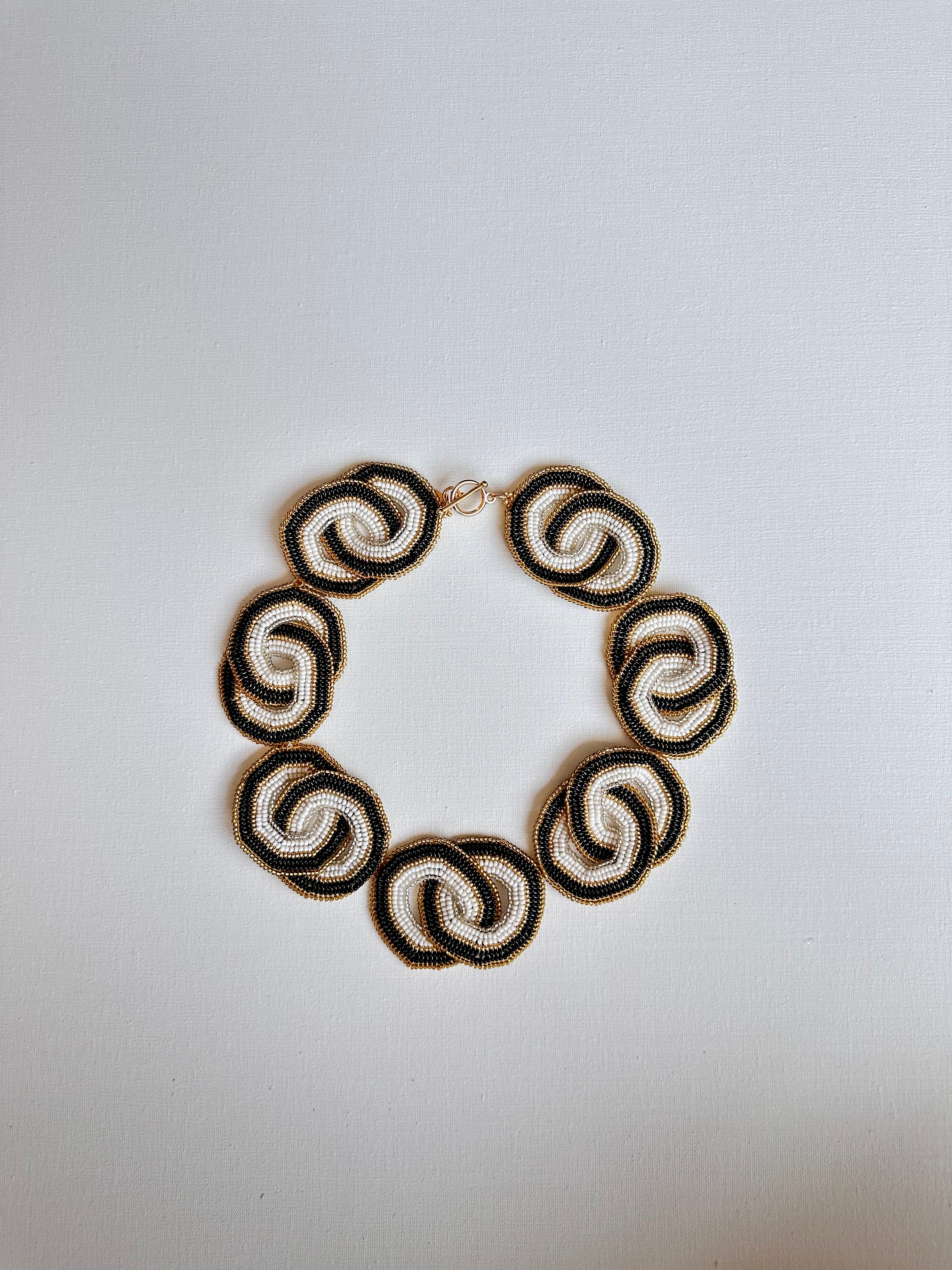 WORK OF THE BEADS CRISSCROSSED CIRCLES NECKLACES